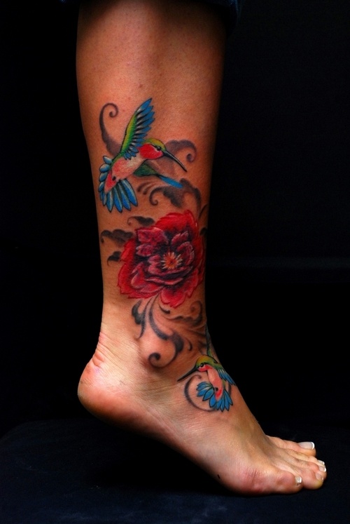 Colorful Two Hummingbird With Flower Tattoo On Leg