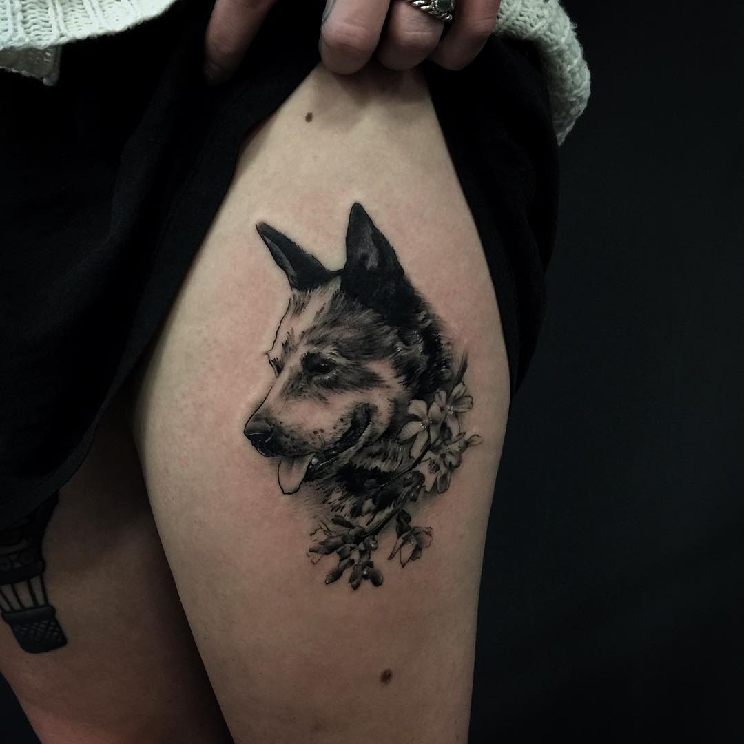 Cute Black Ink Dog Face With Flowers Tattoo On Thigh