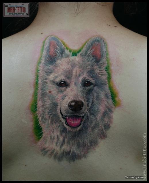 Cute Dog Face Tattoo On Upper Back