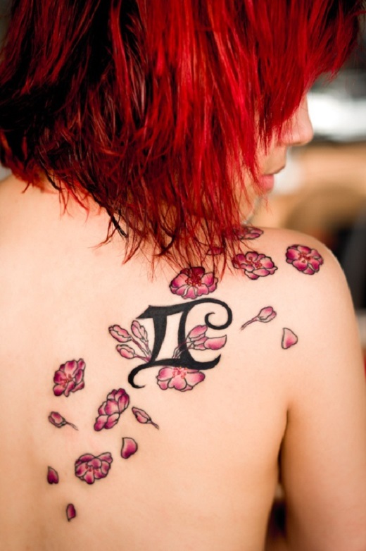 Flowers And Gemini Tattoo On Right Back Shoulder