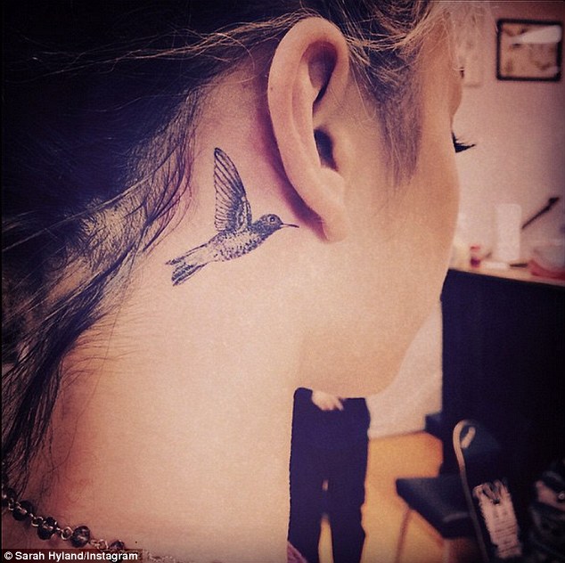 Flying Hummingbird Tattoo On Girl Behind The Ear
