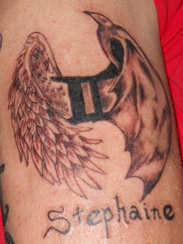 Gemini Zodiac Sign With Angel And Devil Wings Tattoo On Bicep