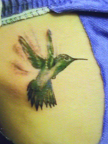 Green Ink Flying hummingbird Tattoo Design