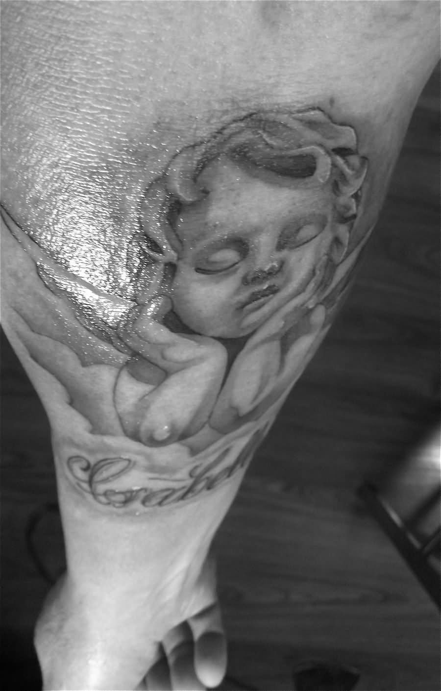 Grey Ink Cupid Cherub Tattoo On Forearm