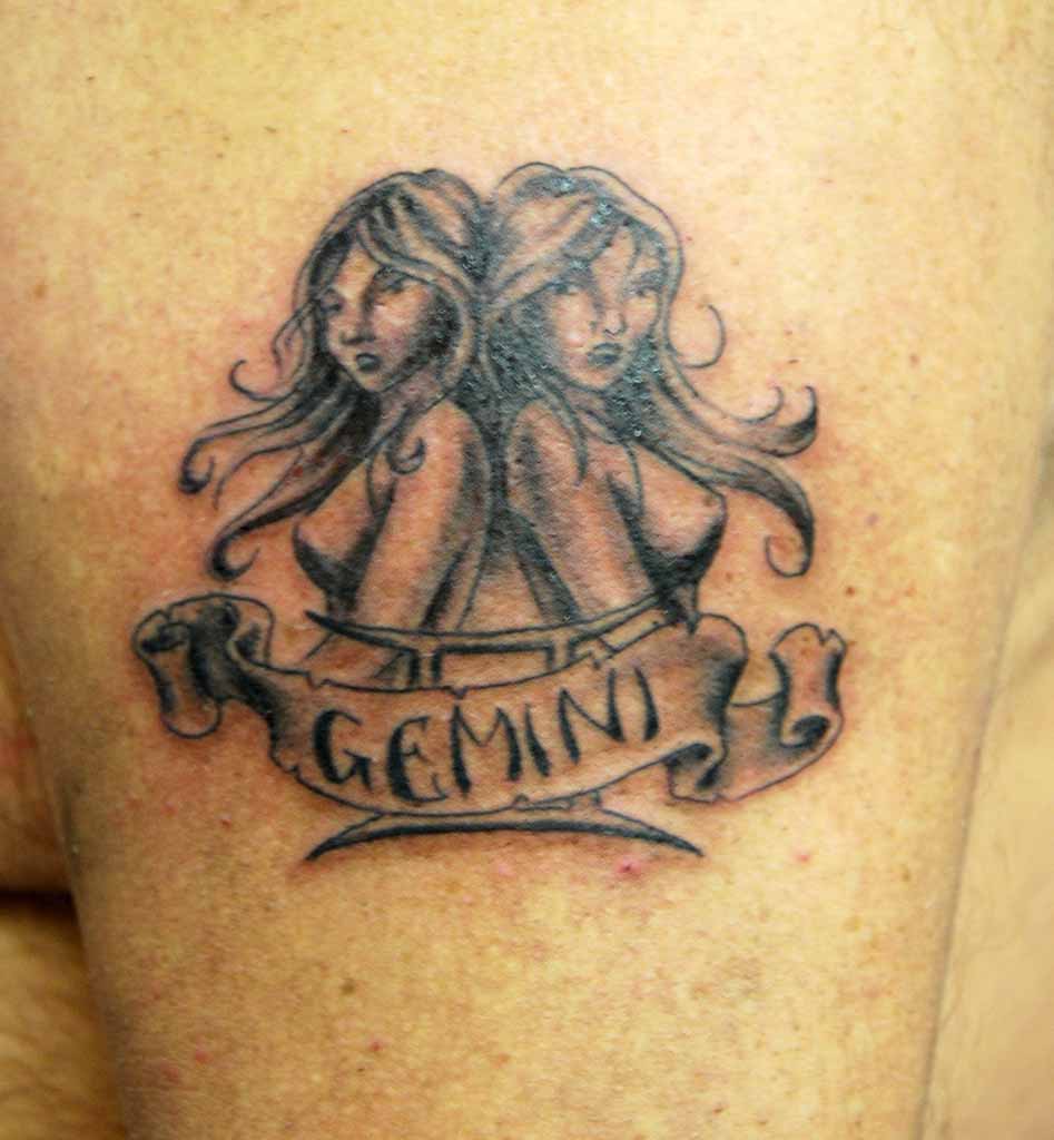 Grey Ink Gemini Girls With Banner Tattoo On Shoulder