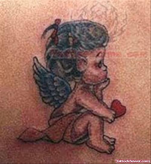 Heart In Cupid Cherub Hand Tattoo Design