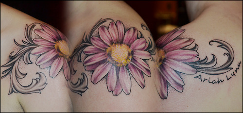 Pink Ink Daisy Flower Tattoo On Shoulder