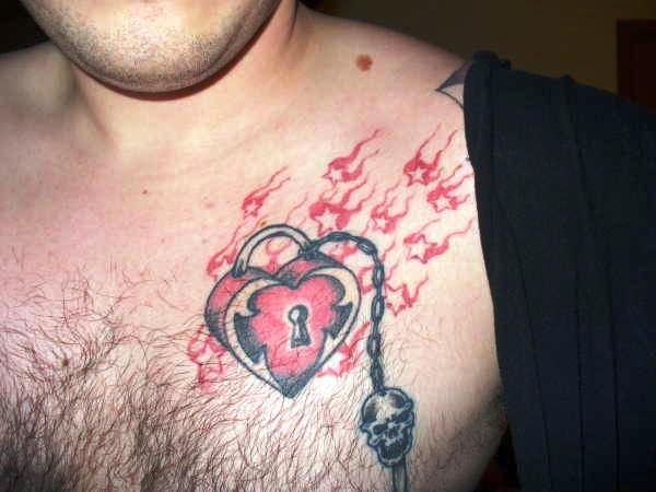 Red And Black Heart Lock With Skull Key Tattoo On Man Chest