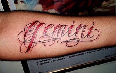 Red Ink Gemini Tattoo On Forearm by The Red Parlour