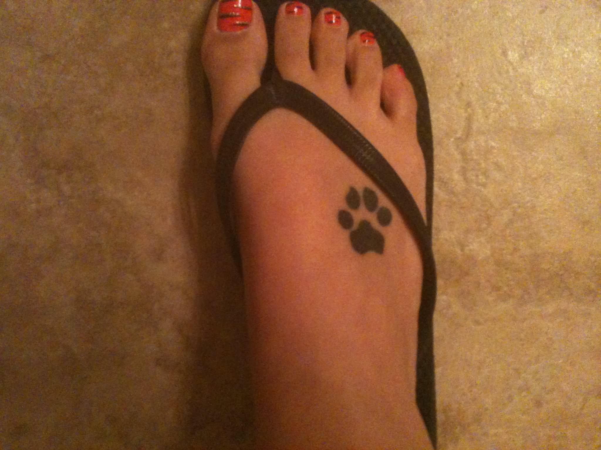 Silhouette Paw Print Tattoo On Girl Foot