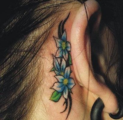 Three Daisy Flowers Tattoo On Behind The Ear