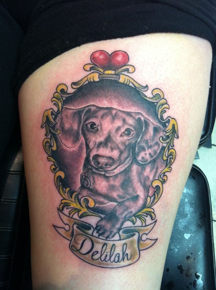 Traditional Dog In Frame With Banner Tattoo On Thigh