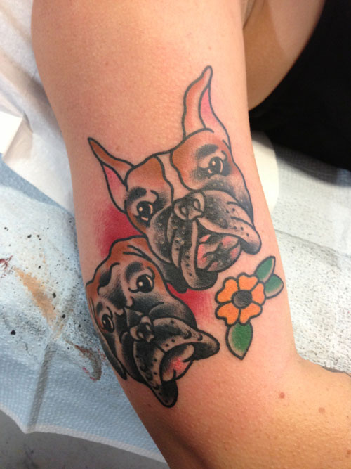 Traditional Two Dog Face Tattoo On Right Half Sleeve
