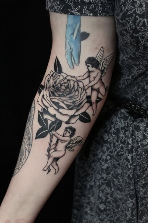 Two Cupid Cherub With Flower Tattoo On Forearm