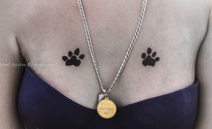 Two Dog Paw Prints Tattoo On Girl Chest