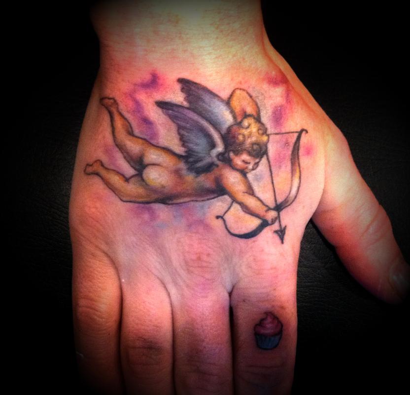 Watercolor Cupid Cherub Tattoo On Hand