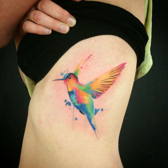 Watercolor Hummingbird Tattoo On Girl Side Rib
