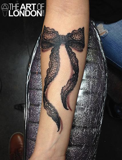 3D Lace Ribbon Bow Tattoo On Forearm