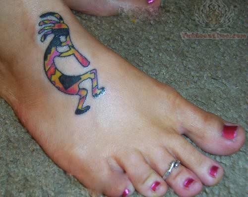 Amazing Kokopelli Tattoo On Girl Foot