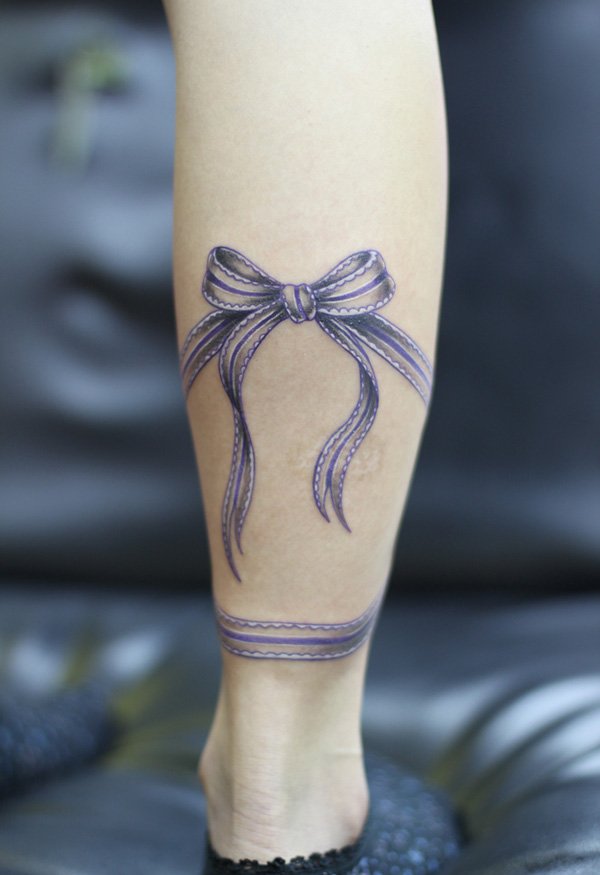 Amazing Purple Ribbon Bow Tattoo Design For Leg Calf