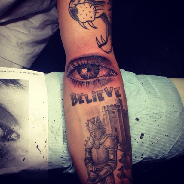 Believe - Black And Grey Eye Tattoo On Forearm By Kamil Czapiga