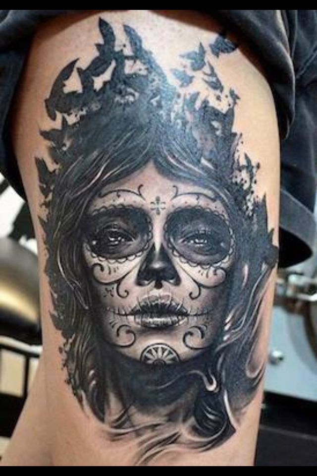Black And Grey Dia De Los Muertos Girl Face With Flying Birds Tattoo On Thigh