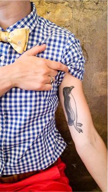 Black And White Penguin Tattoo On Inner Bicep