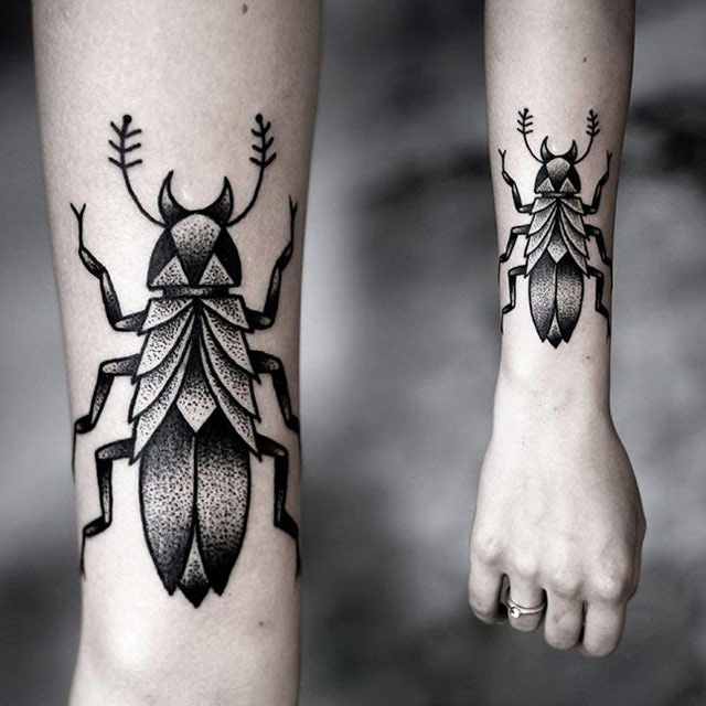 Black Dotwork Insect Tattoo On Forearm