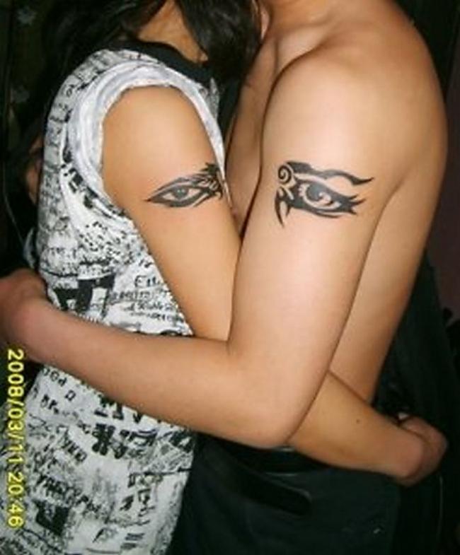 Black Eye Tattoo On Couple Arm