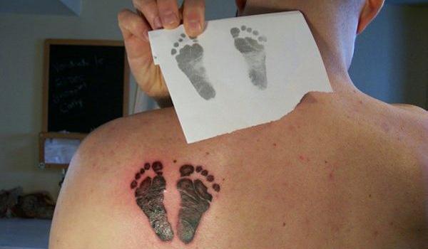 Black Footprints Tattoo On Left Back Shoulder