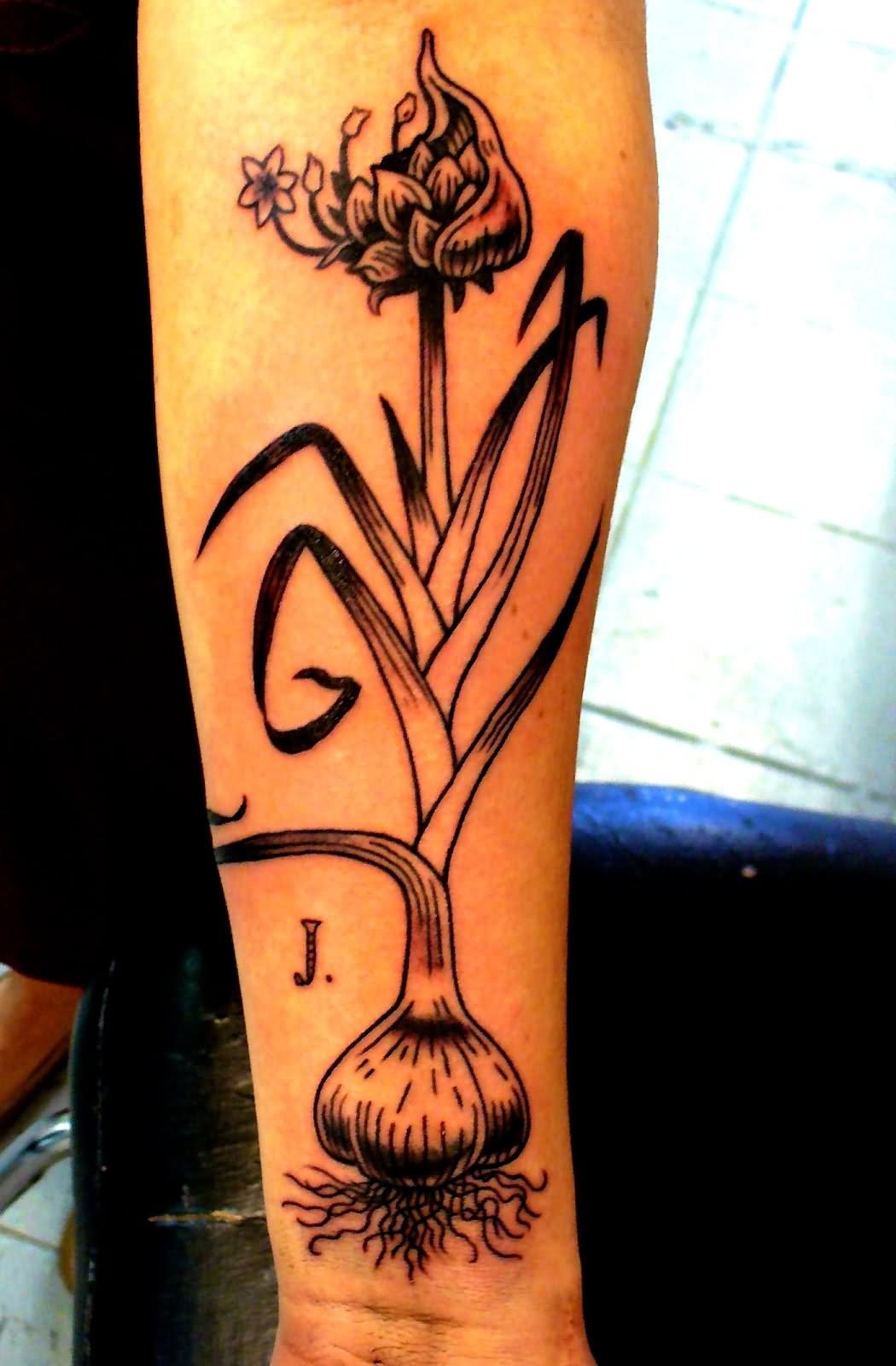 Black Garlic Tattoo On Forearm