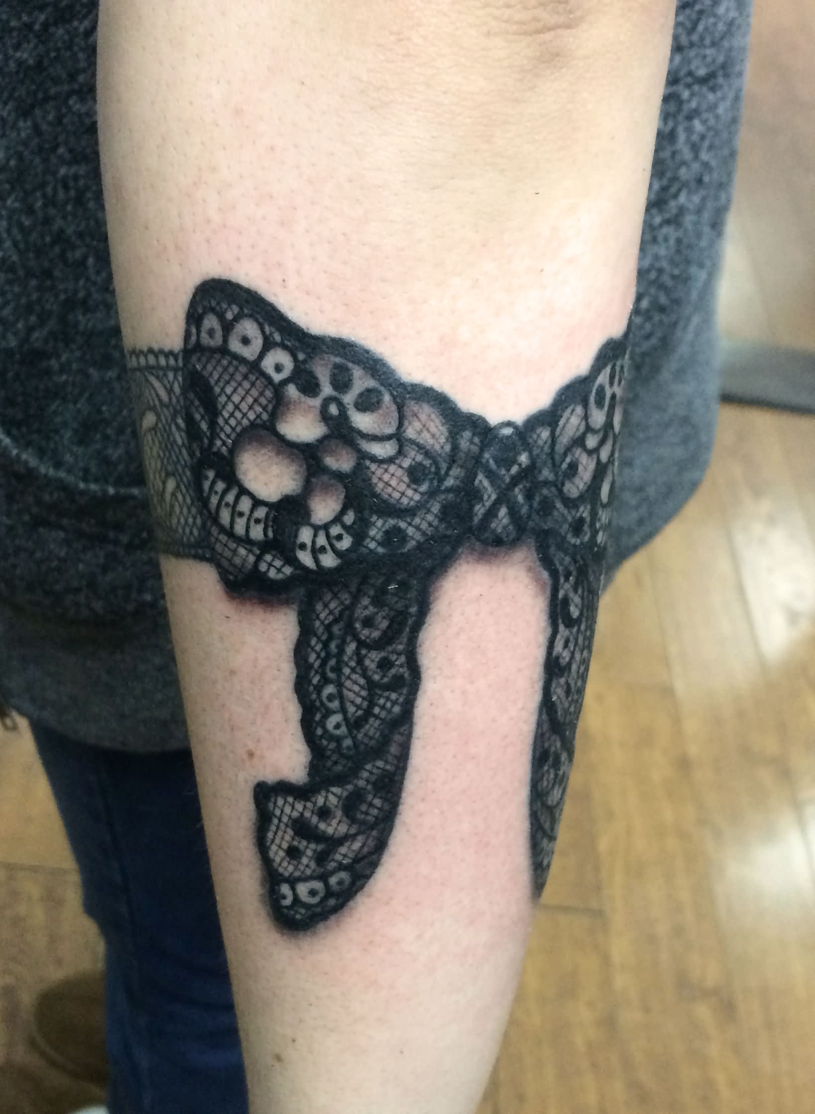 Black Ink 3D Lace Ribbon Bow Tattoo Design For Arm