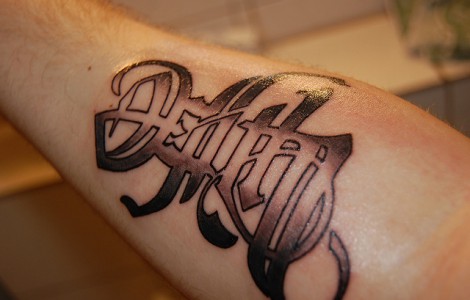 Black Ink Death Lettering Tattoo Design For Forearm