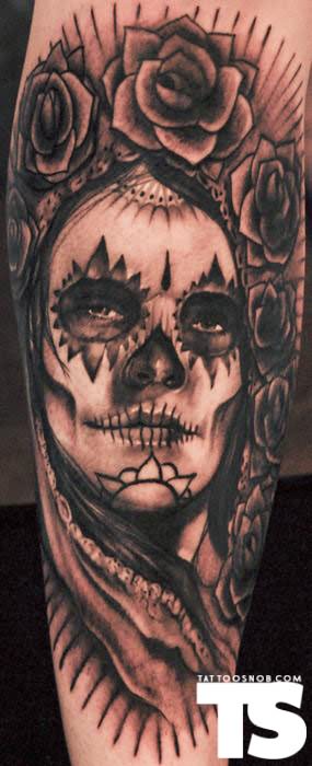 Black Ink Dia De Los Muertos Face With Flowers Tattoo Design For Arm