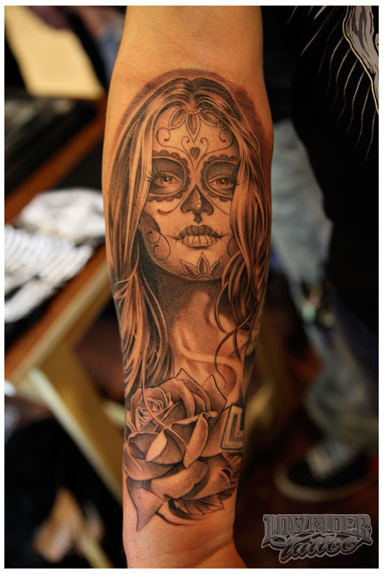 Black Ink Dia De Los Muertos Girl Face With Rose Tattoo On Sleeve
