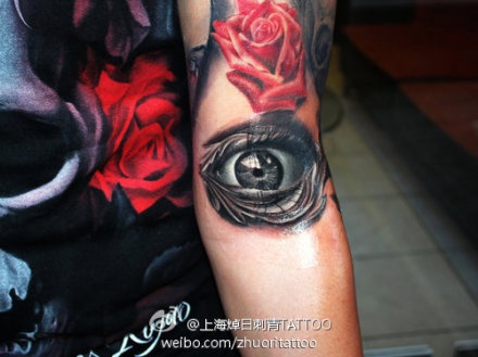 Black Ink Eye With Rose Tattoo Design For Arm By Kostas Baronis