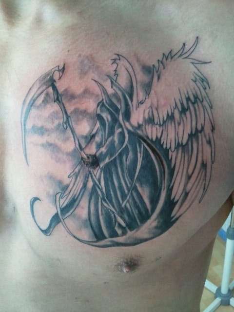 Black Ink Grim Reaper Death Tattoo On Man Chest