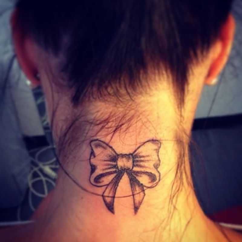 Black Ink Ribbon Bow Tattoo On Back Neck