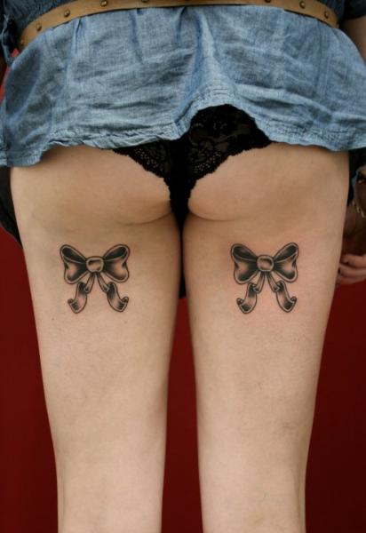 Black Ink Ribbon Bow Tattoo On Back Thigh