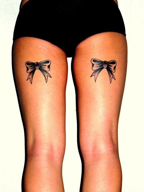 Black Ink Ribbon Bow Tattoo On Both Back Leg