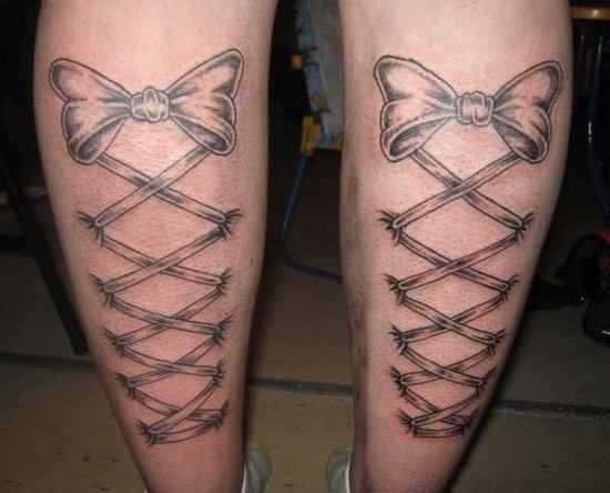 Black Ink Ribbon Corset Tattoo On Both Leg Calf