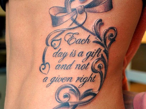 Black Ink Ribbon With Words Tattoo Design For Side Rib