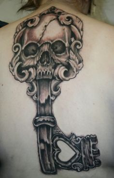 Black Ink Skull Key Tattoo Design For Upper Back