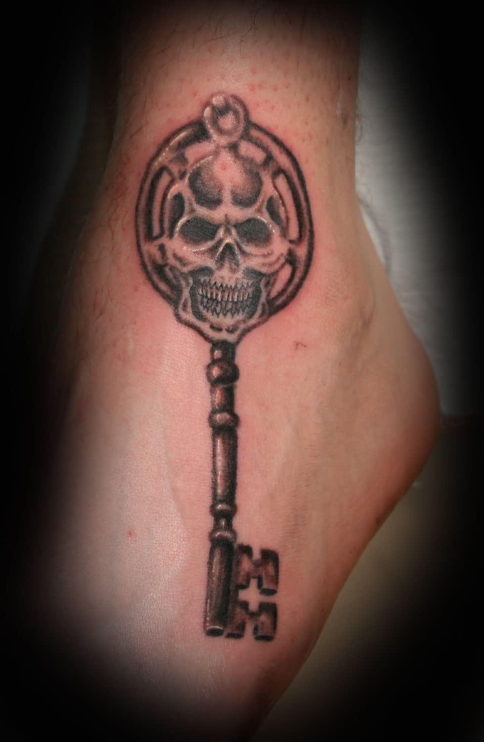 Black Ink Skull Key Tattoo On Leg