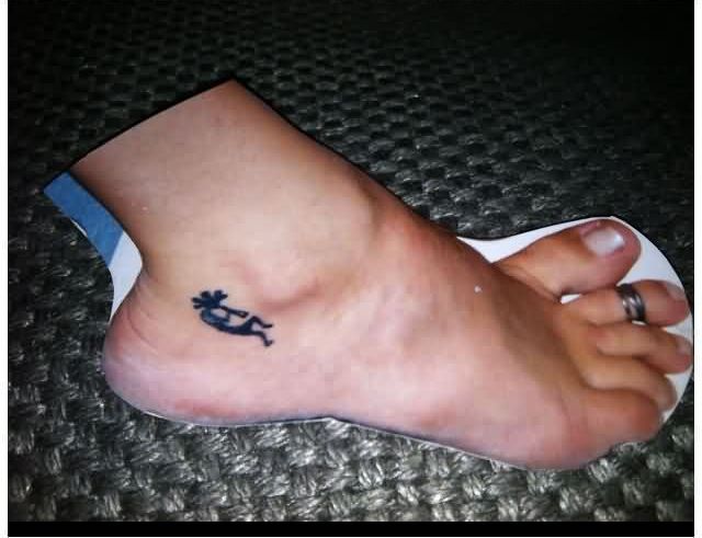 Black Kokopelli Tattoo On Ankle