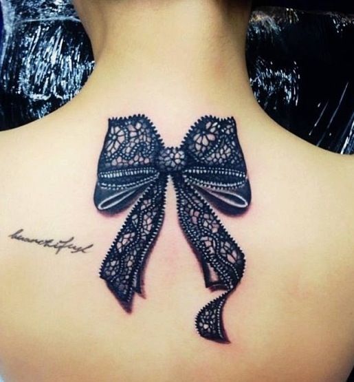 Black Lace Ribbon Bow Tattoo On Upper Back