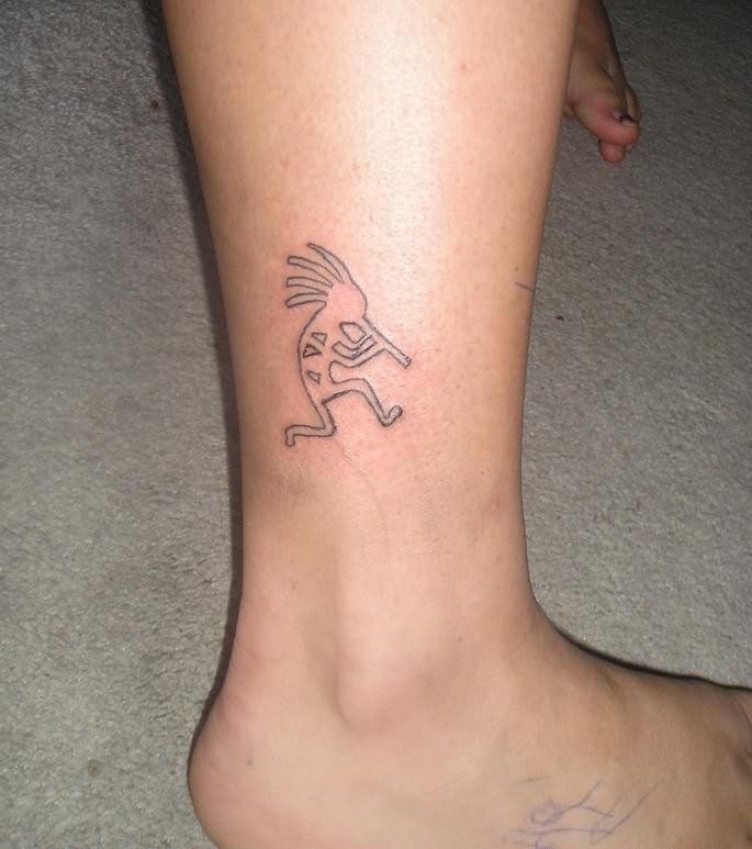 Black Outline Kokopelli Tattoo On Leg