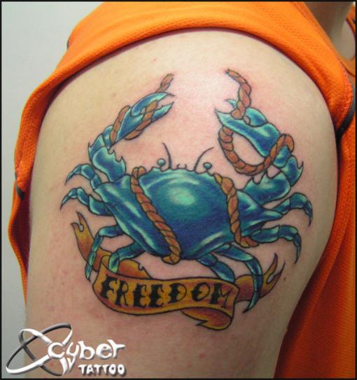 Blue Crab With Rope And Freedom Banner Tattoo On Shoulder