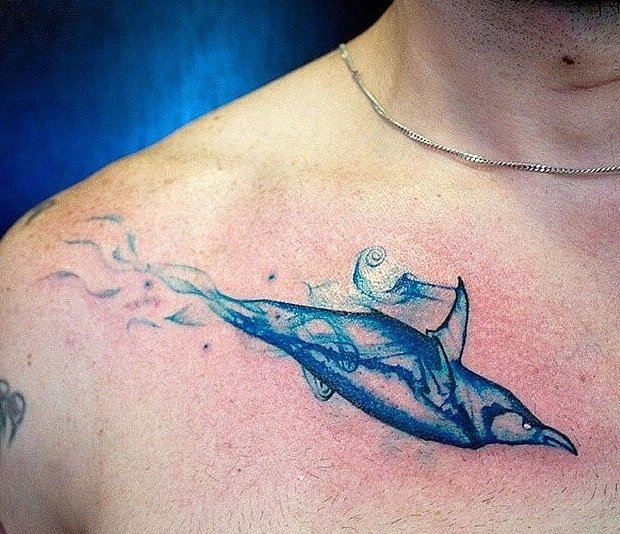 Blue Ink Penguin Tattoo On Collarbone