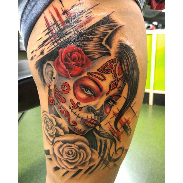 Colorful Dia De Los Muertos Girl Face With Roses Tattoo On Thigh